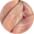 Raw chicken breasts closely arranged on a surface, showing the pink color and smooth texture of the uncooked meat.