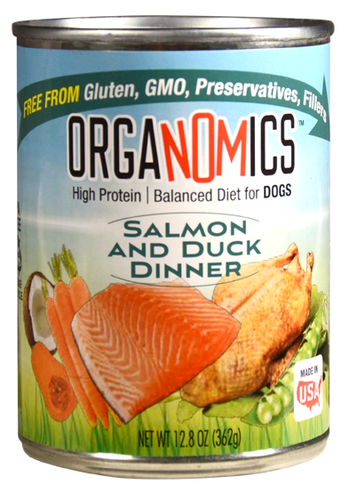 A case of 12 Organomics Variety Pack for Dogs (12.5 oz cans), featuring Salmon and Duck Dinner high-protein dog food that’s gluten-free, GMO-free, preservative-free, and showcases images of salmon, duck, carrots, peas, and coconut on the label.