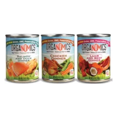 A Variety Pack for Dogs - Case of 12, 12.5 oz Cans, featuring three different ORGANOMICS dog food flavors—Salmon and Duck, Chicken, and Lamb and Beef—with images of ingredients displayed on the labels.