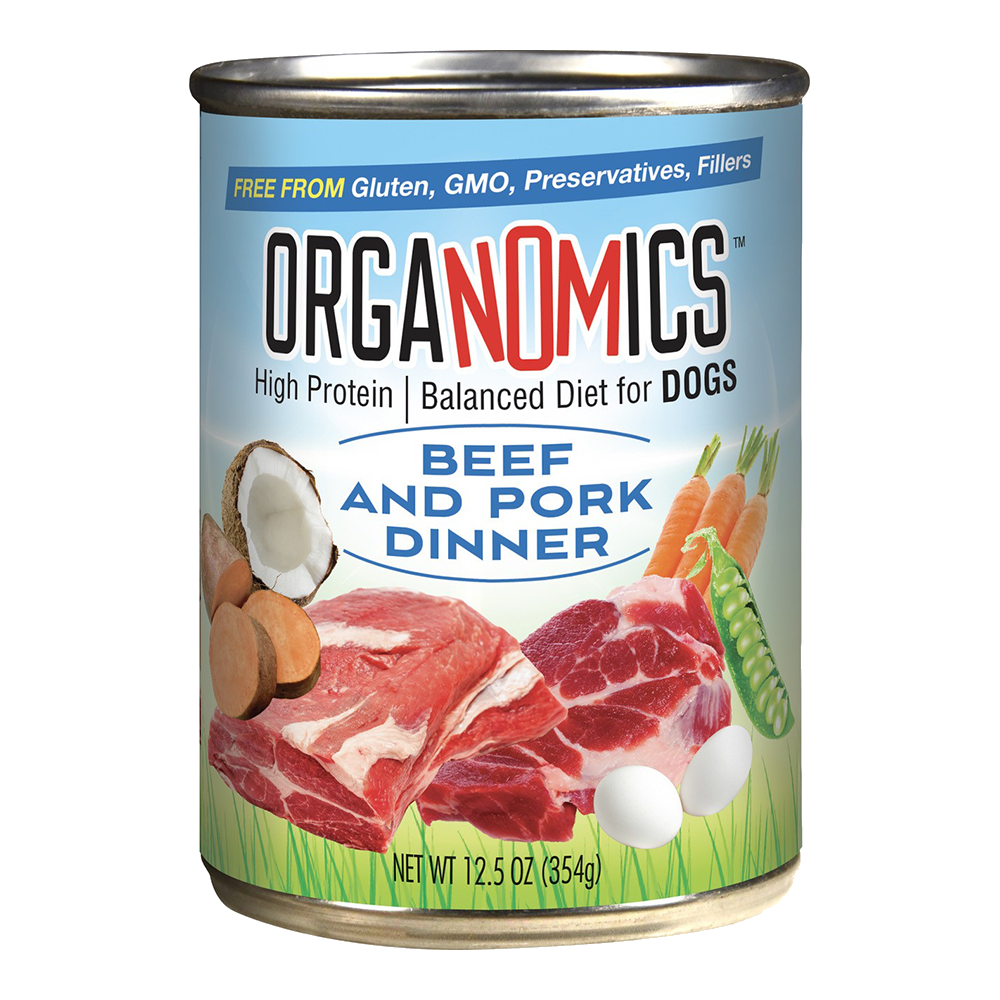 A can of OrgaNOMics Beef and Pork Dinner for Dogs, featuring images of beef, pork, eggs, coconut, carrots, and peas on the label. Net weight: 12.5 oz (354g).