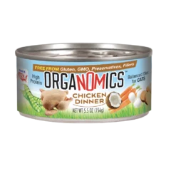 A 5.5 oz can of OrgaNOMics Chicken Dinner for Cats, featuring a high-protein, balanced diet formula and packaging with images of chicken, peas, carrots, and eggs.