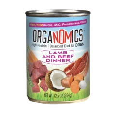 A 12.5 oz can of OrgaNOMics Lamb and Beef Dinner for Dogs, with a label displaying images of meat, coconut, carrots, and sweet potato.