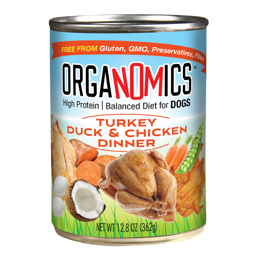 A can from the OrgaNOMics Turkey Duck & Chicken Dinner for Dogs - 12, 12.5 oz cans set, featuring images of cooked poultry, vegetables, and coconut on the label along with detailed product information.