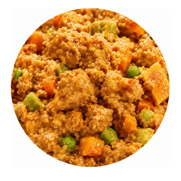 Close-up of cooked ground meat mixed with diced carrots, peas, and a brown sauce or gravy, shown in a circular frame.