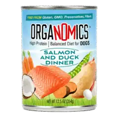 A 12.5 oz can from the OrgaNOMics Salmon and Duck Dinner for Dogs pack (12 cans), displaying salmon, duck, carrots, peas, and coconut visuals alongside text emphasizing its high-protein content, balanced nutrition, and gluten- and GMO-free formulation.